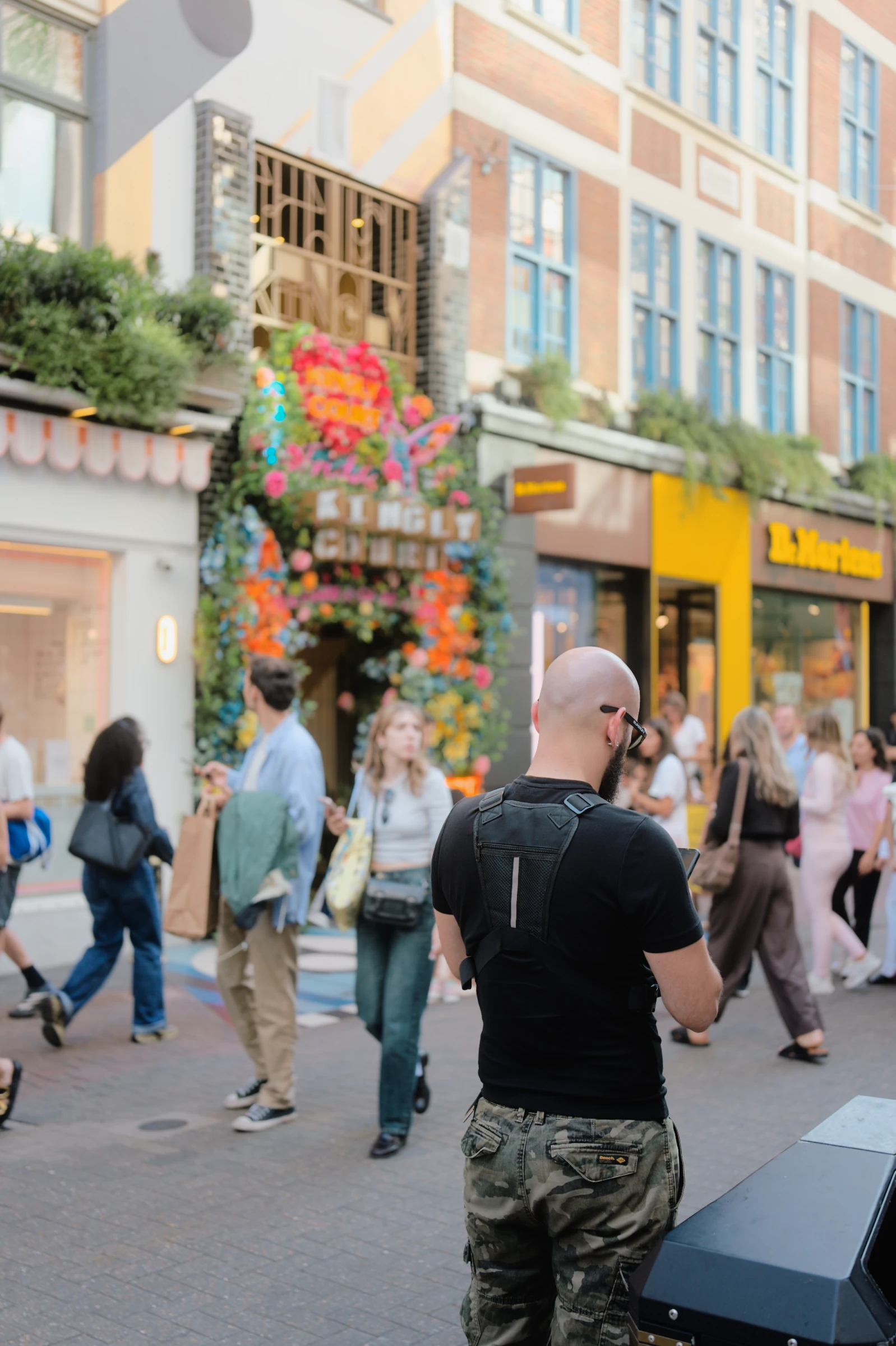 People within a colourful shopping street